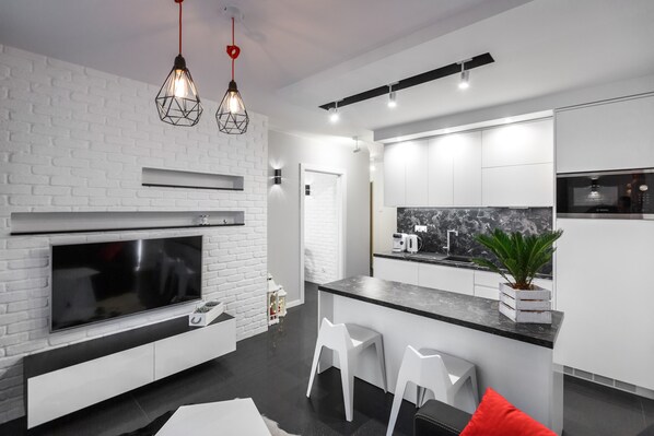 Departamento | Área de sala de estar | Televisión de pantalla plana de 49 pulgadas con canales por cable