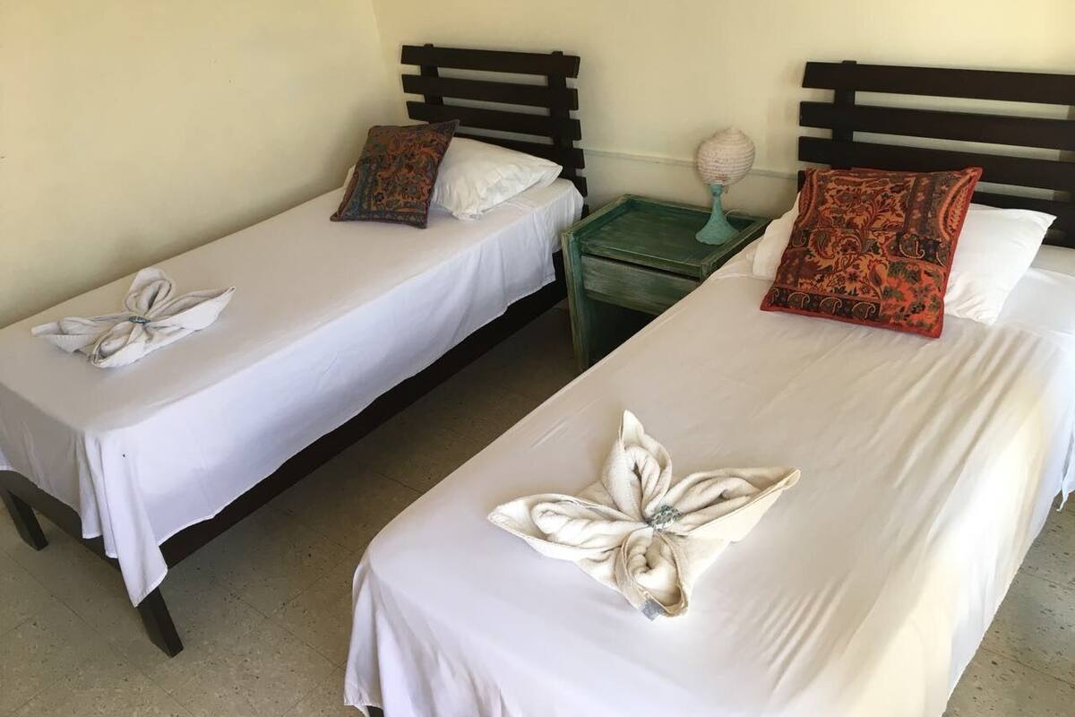 Twin Room, City View (Shared Bathroom) | Iron/ironing board, free WiFi, bed sheets