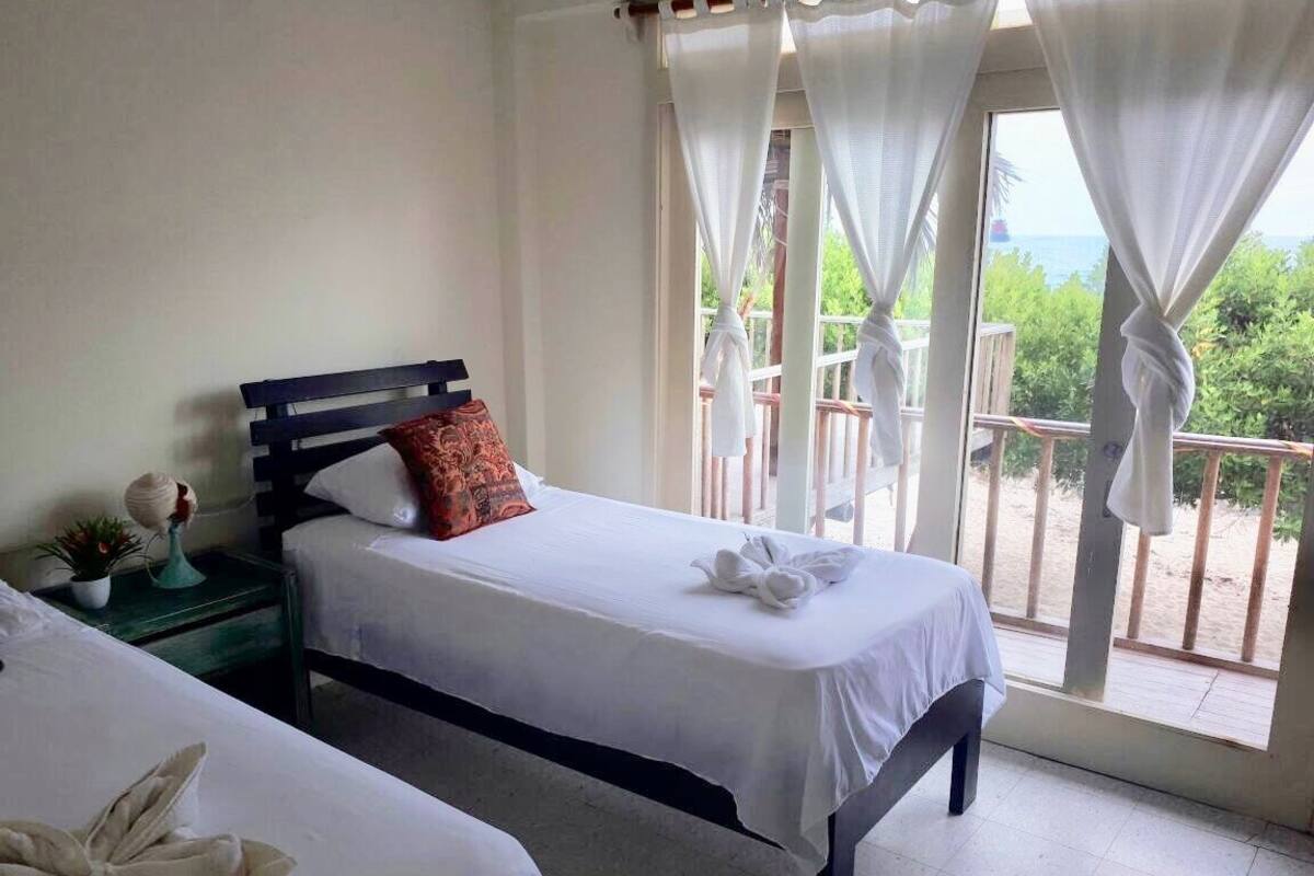 Twin Room, Ocean View | Iron/ironing board, free WiFi, bed sheets