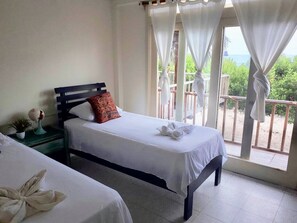 Twin Room, Ocean View | Iron/ironing board, free WiFi, bed sheets