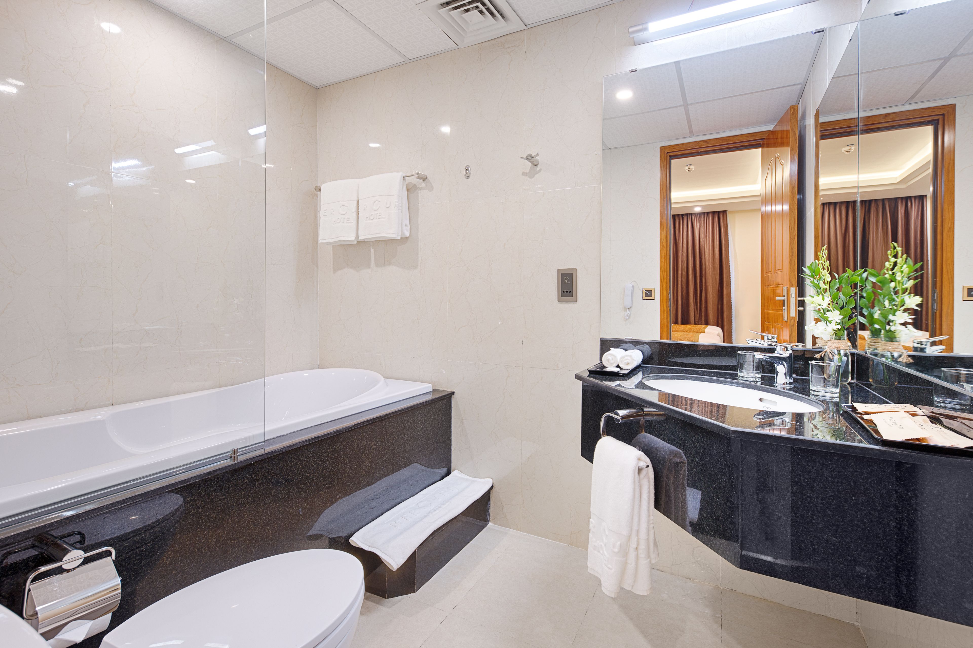 combined shower/bathtub, deep-soaking bathtub, rainfall showerhead