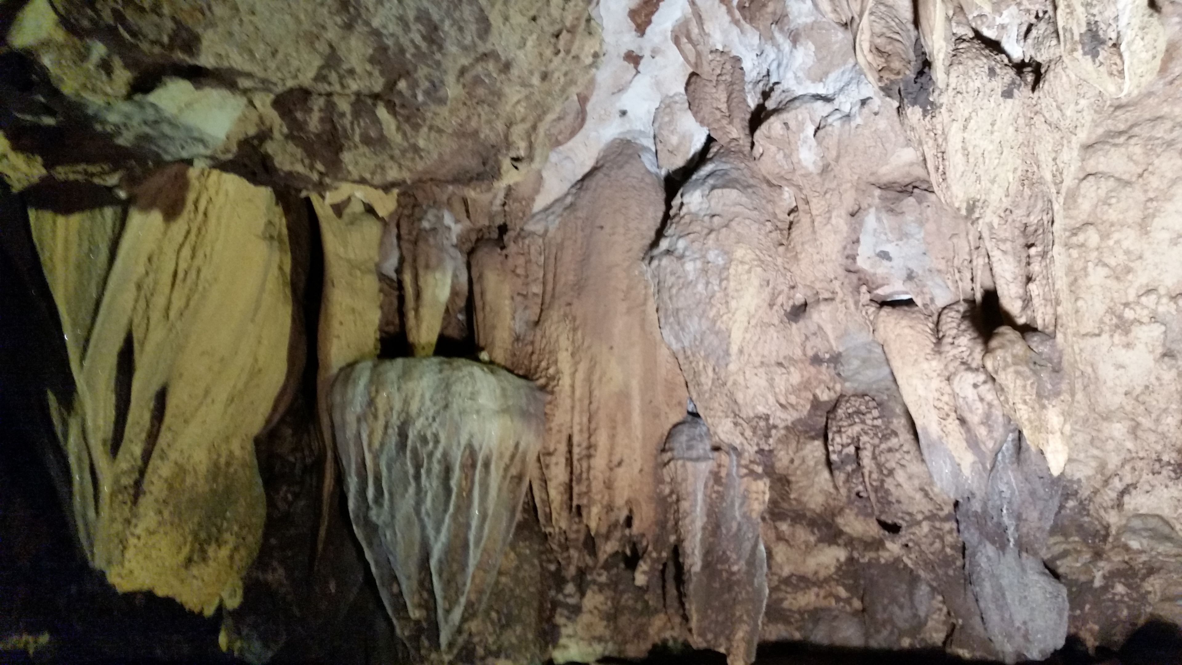 A cave interior with stalactites and stalagmites.