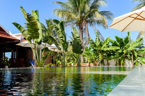 Outdoor pool, open 7:00 AM to 10:00 PM, pool umbrellas, pool loungers