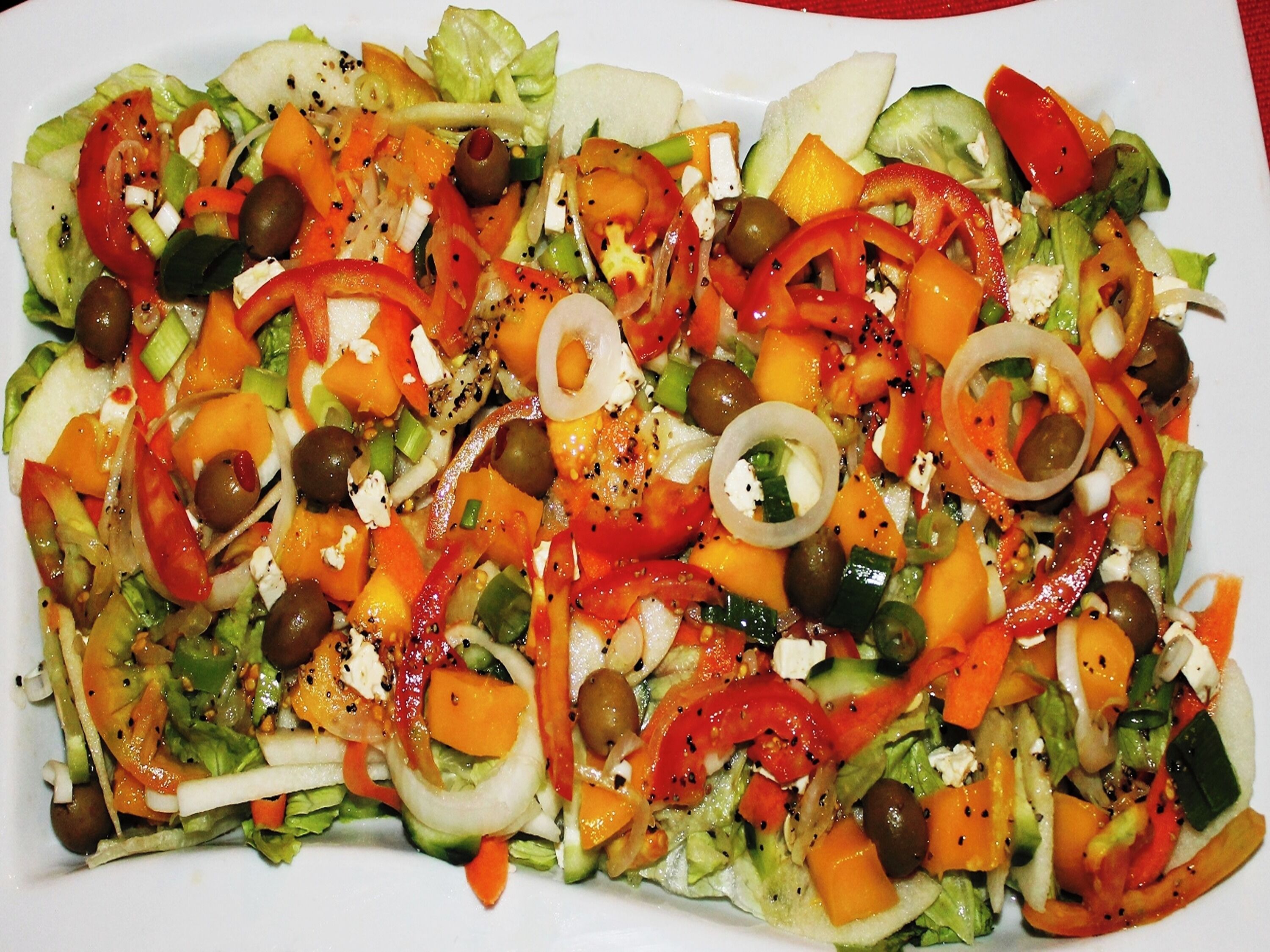 A colorful vegetable salad with various ingredients.