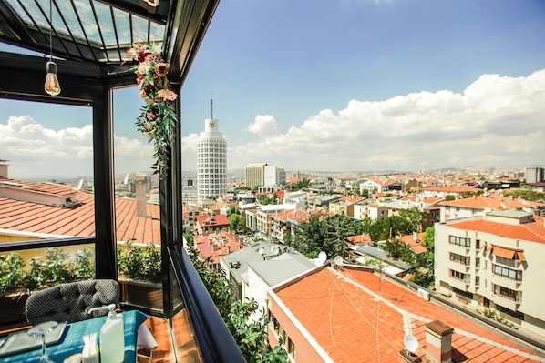 A balcony with a view of a cityscape, including a prominent tower and various buildings. - The Life Hotel & Spa (Ankara)