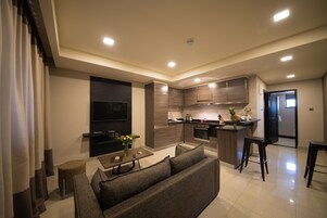 One Bedroom Suite | Living area | Flat-screen TV