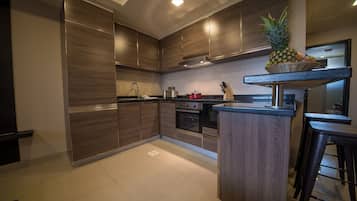 One Bedroom Suite | Private kitchen | Fridge, microwave, coffee/tea maker