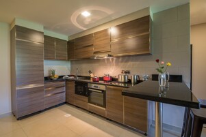 Two Bedroom Superior Suite | Shared kitchen | Fridge, microwave, coffee/tea maker