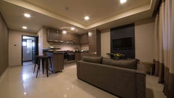 One Bedroom Suite | Living area | Flat-screen TV