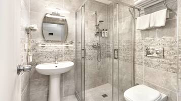 Shower, free toiletries, hair dryer, slippers