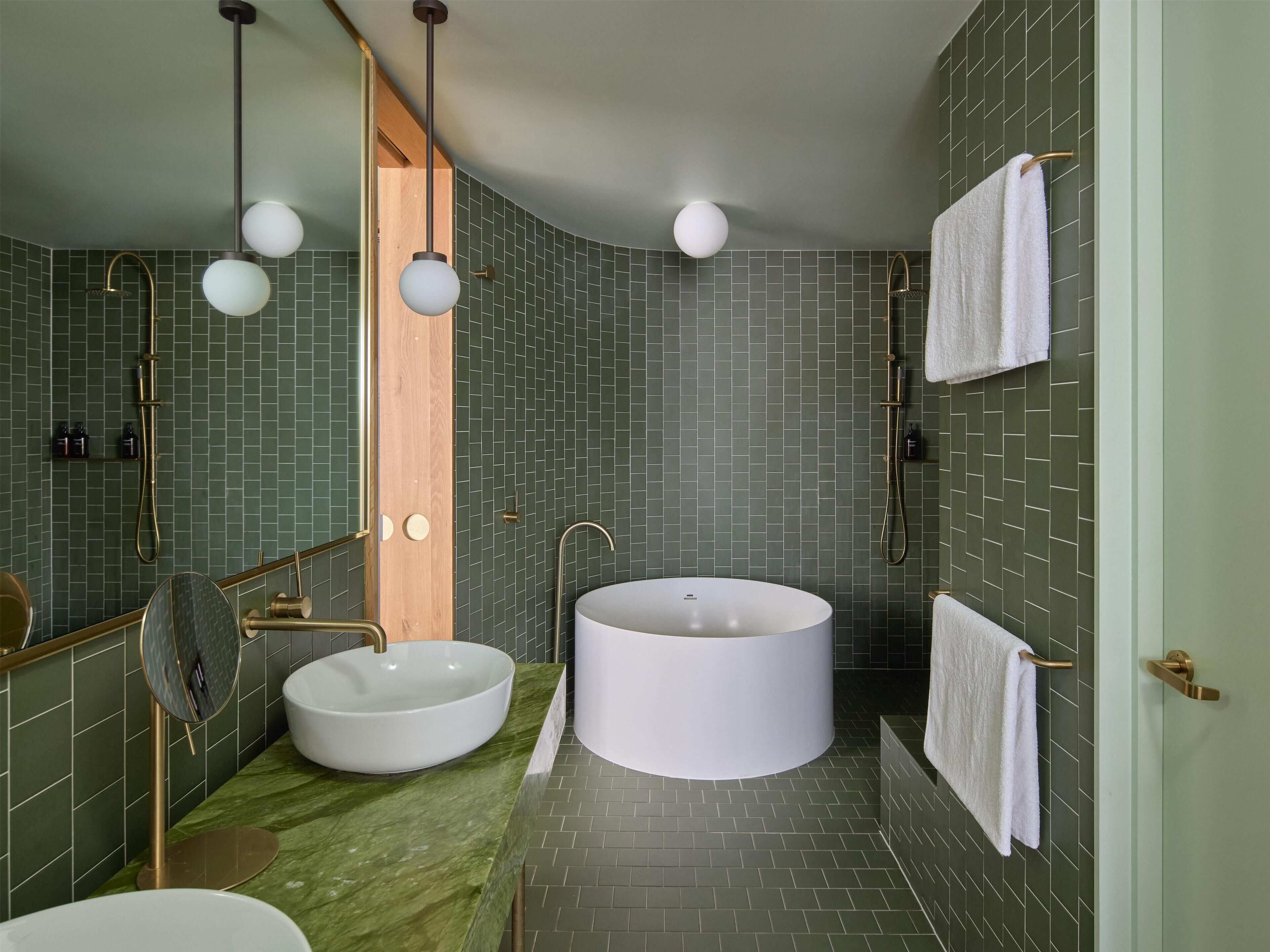 Junior Suite, 1 King Bed, City View | Bathroom | Designer toiletries, hair dryer, bathrobes, slippers