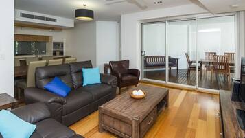 Family Apartment, 3 Bedrooms, Pool Access, Beachfront | Living room | TV, DVD player