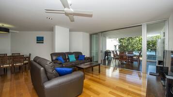Family Apartment, 3 Bedrooms, Pool Access, Beachfront | Living area | TV, DVD player