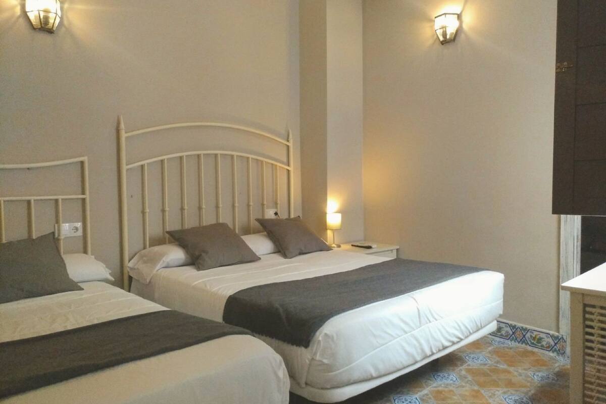 Twin Room, Courtyard View | Down comforters, desk, blackout drapes, free WiFi