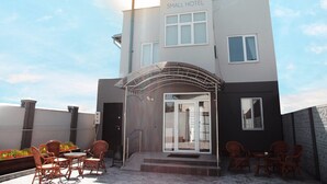 A modern building with a sign reading "SMALL HOTEL". - Small Hotel Bishkek (Bishkek)