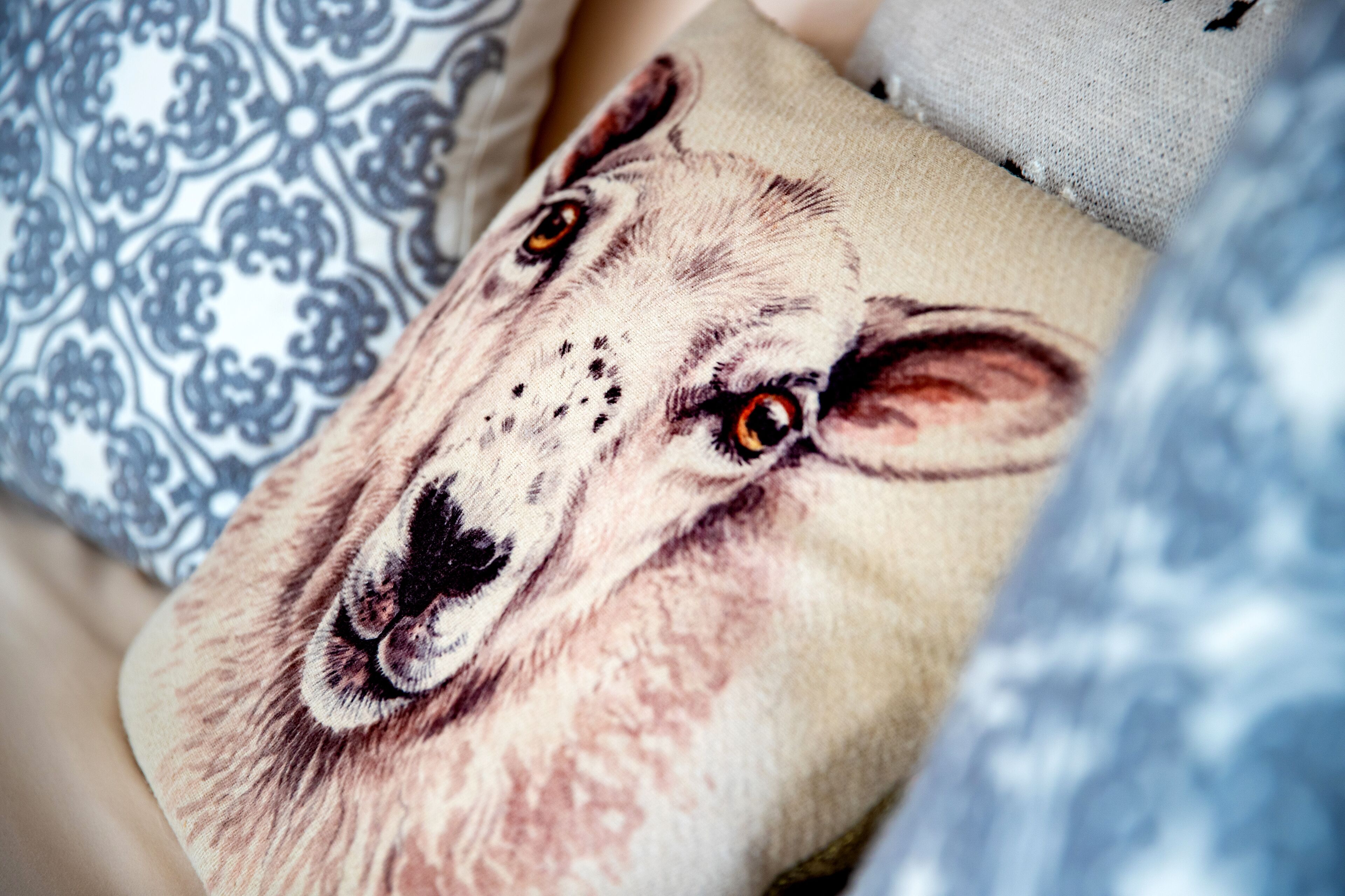 A pillow with a detailed animal print.