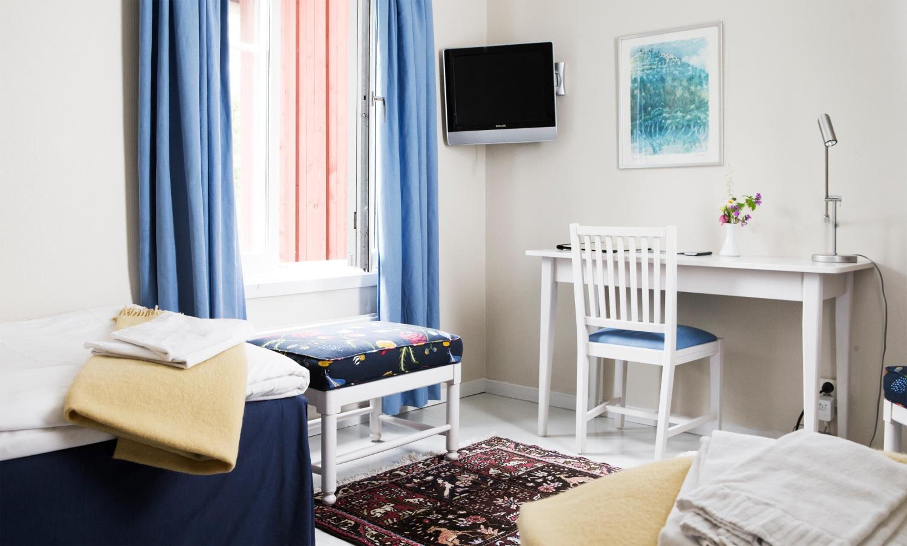 family room | premium bedding, desk, blackout curtains, iron/ironing board