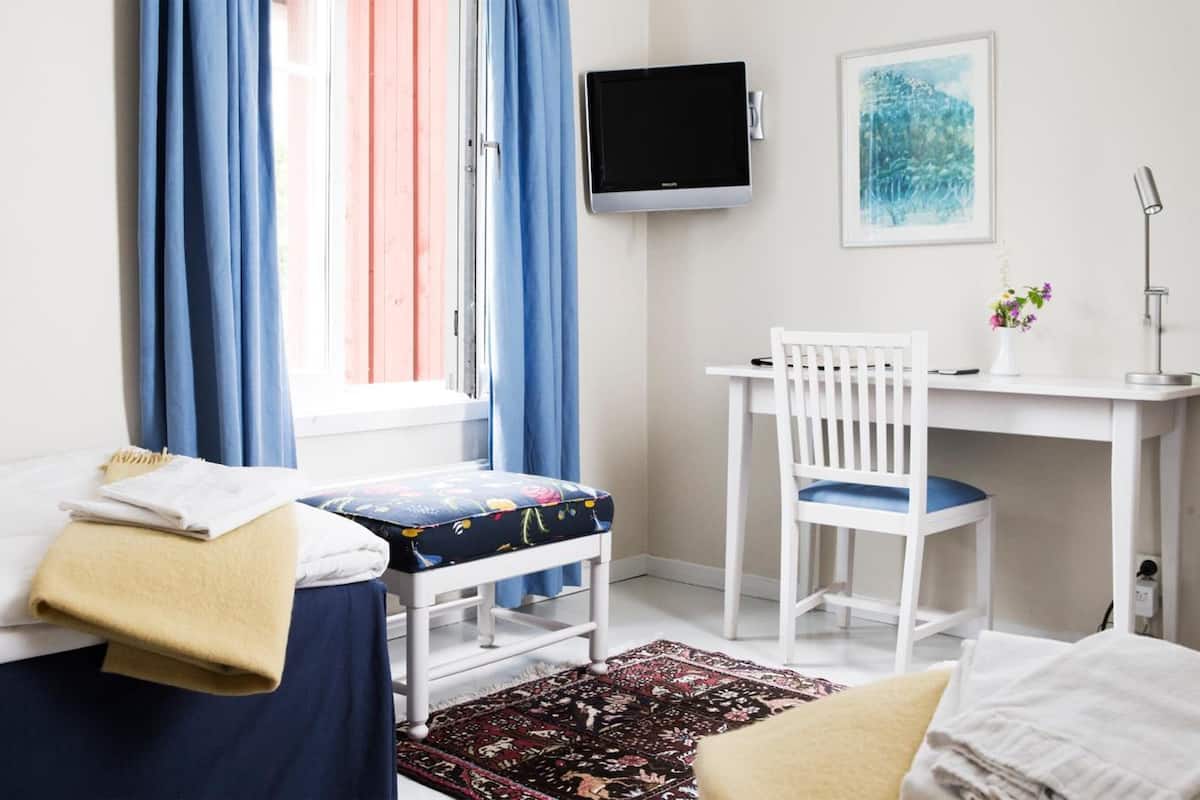 family room | premium bedding, desk, blackout curtains, iron/ironing board