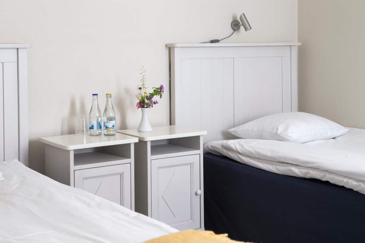 family room | premium bedding, desk, blackout curtains, iron/ironing board