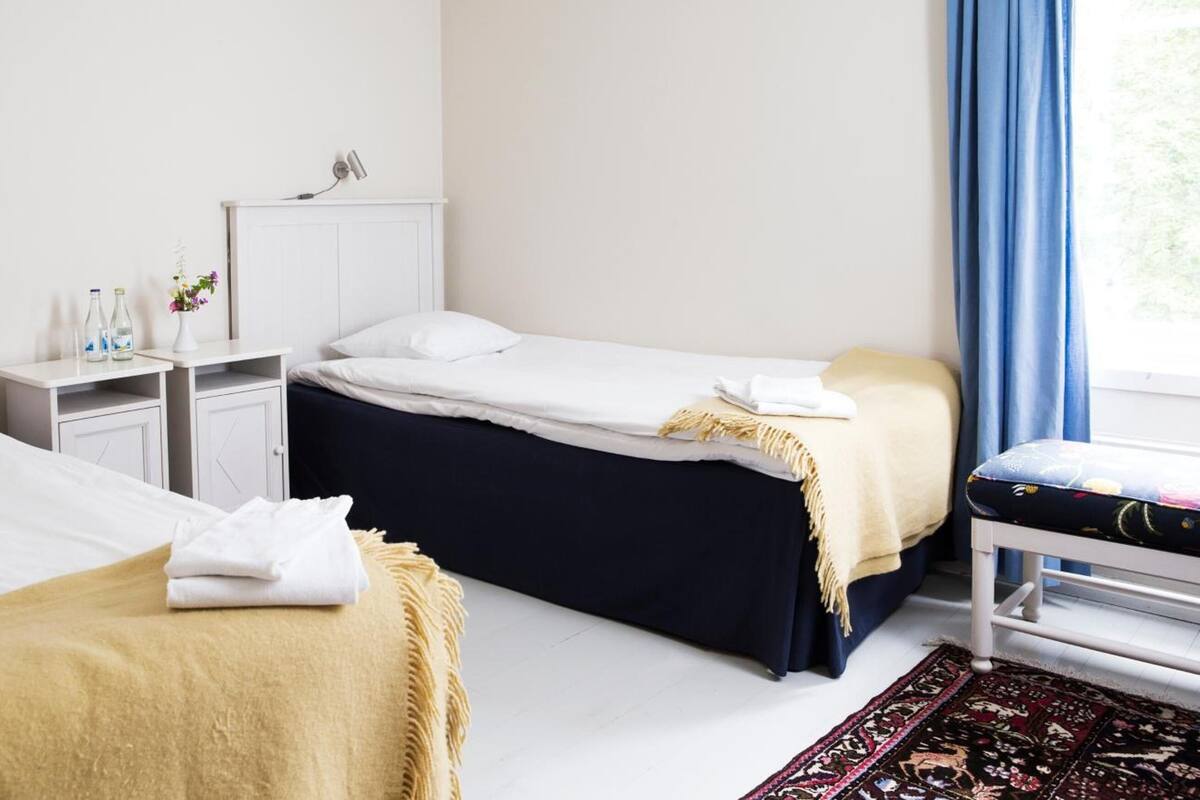 family room | premium bedding, desk, blackout curtains, iron/ironing board