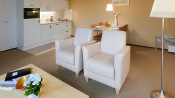 Apartment, 1 Bedroom | Living area | Flat-screen TV