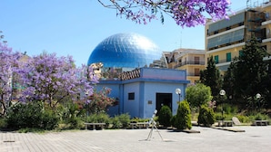 A building with a blue dome and a small entrance. - Abacus (Reggio Calabria)