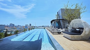 Outdoor pool, a rooftop pool, open 7:30 AM to 9:00 PM, sun loungers