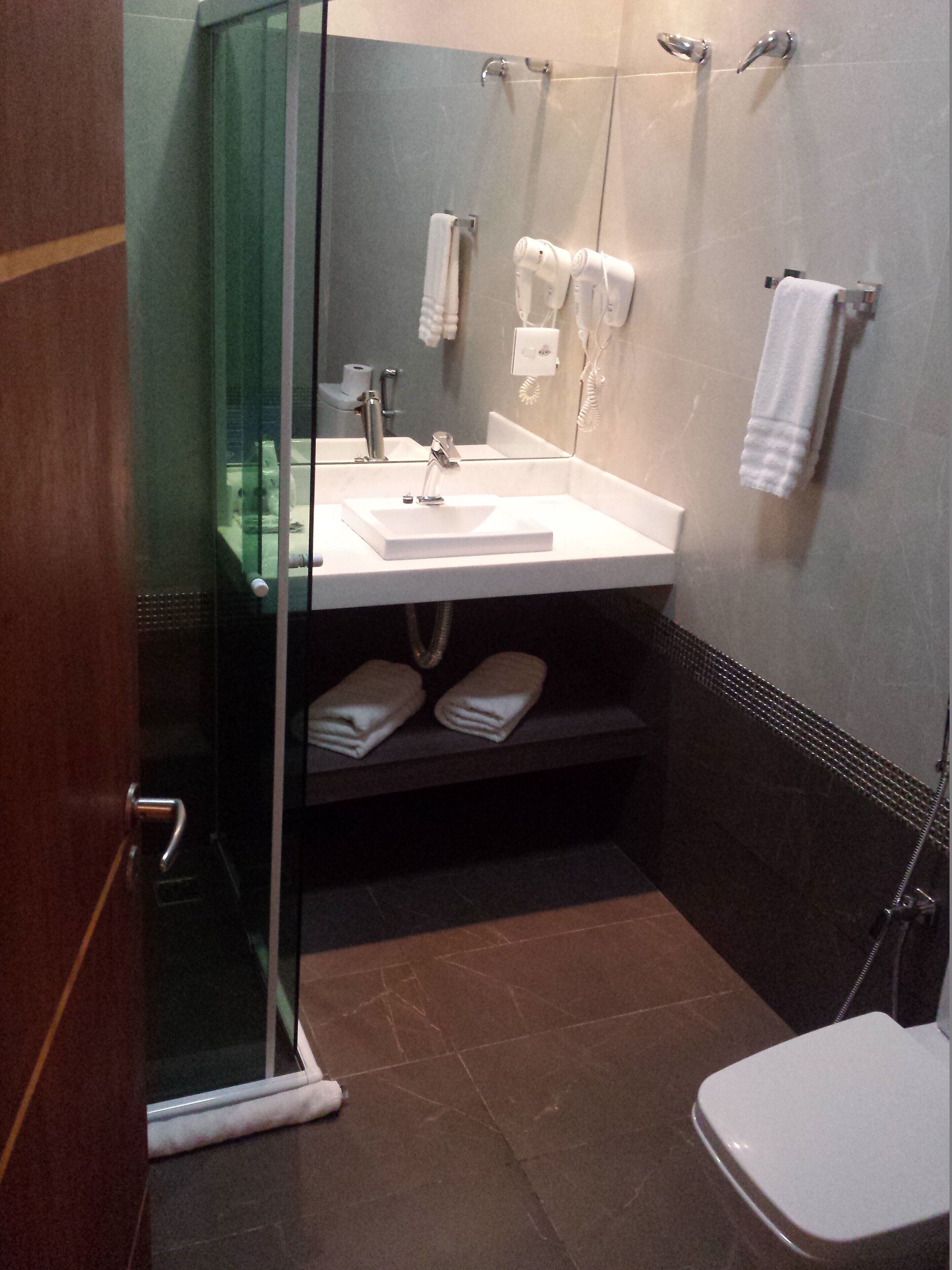 shower, free toiletries, hair dryer, towels