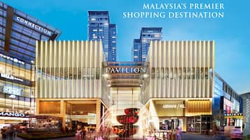 A modern shopping mall with prominent stores like Pavilion, Armani/Prada, and Mango.