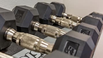 A set of black dumbbells with visible weight markings and metallic handles.