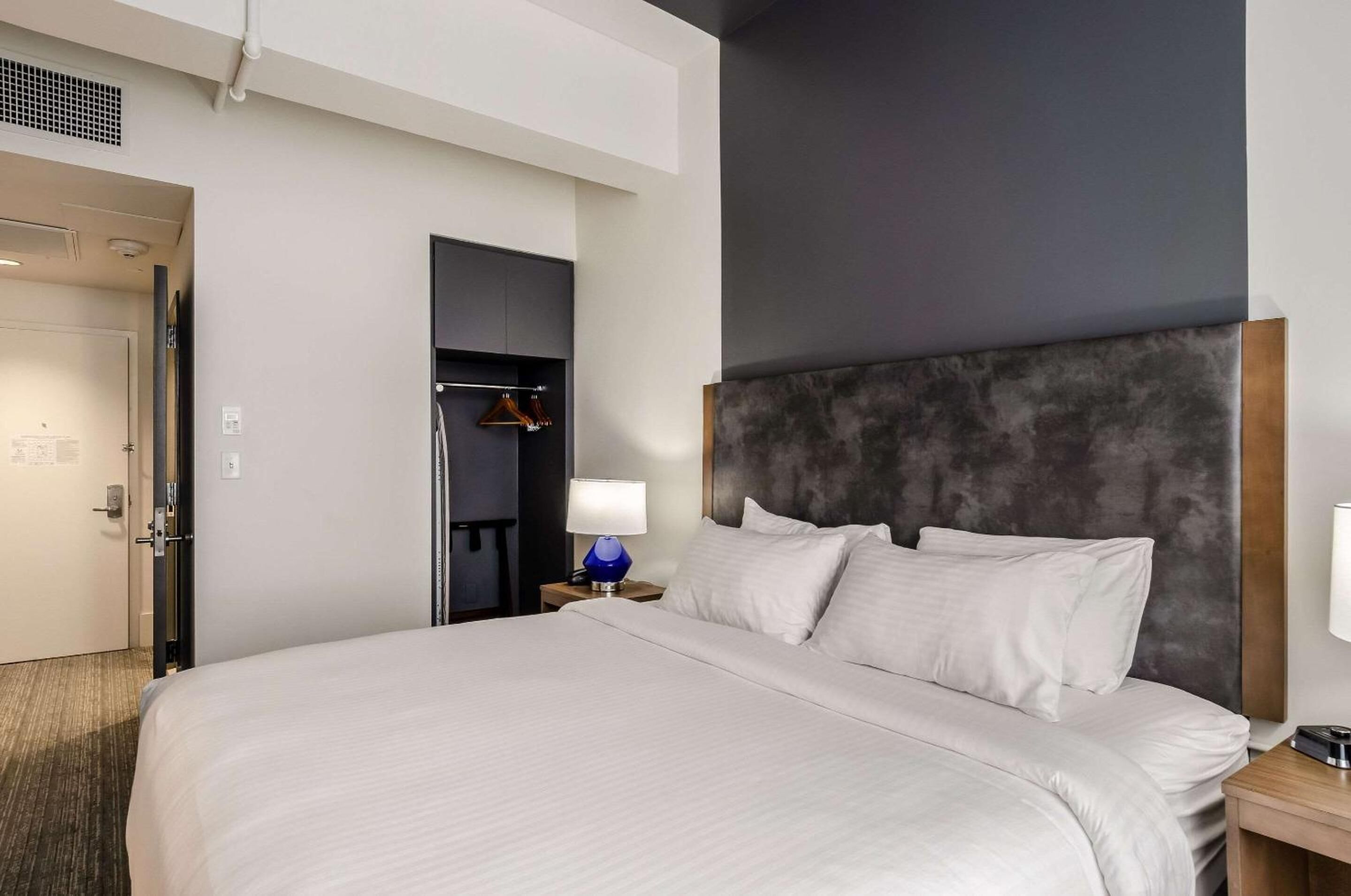 Premium bedding, laptop workspace, blackout drapes, iron/ironing board