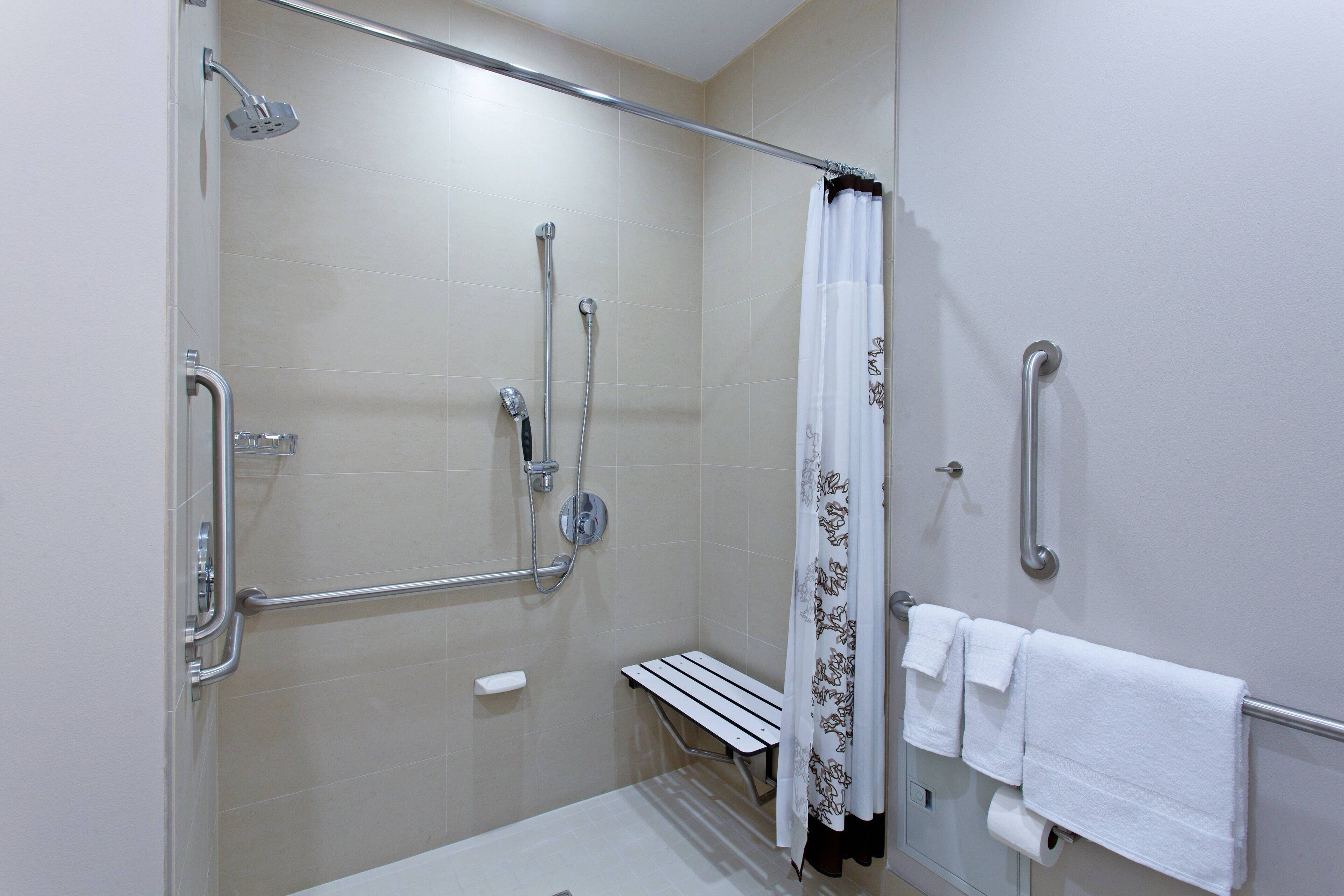 studio suite, 1 king bed with sofa bed (mobility/hearing access, roll-in shwr) | bathroom | hair dryer, towels, soap, shampoo