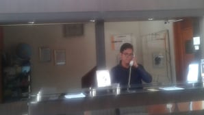 A reception area with a sign reading "RECEPCION" above a counter. - Hotel Plaza Bolognesi (Trujillo)
