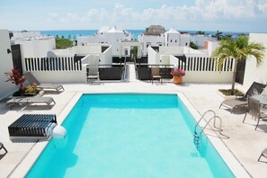 Outdoor pool, a rooftop pool, sun loungers
