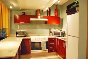 Condo, 2 Bedrooms | Private kitchen | Fridge, microwave, oven, stovetop