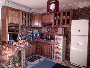 Comfort Apartment | Private kitchen | Full-size fridge, microwave, oven, stovetop