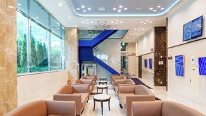 A lobby with seating, a staircase, and artwork on the walls. - Toyoko Inn Incheon Bupyeong (Incheon)