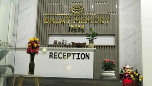 A reception desk with a sign reading "RECEPTION" and "DALAT MEMORY INN" above it. - Dalat Memory Inn (Xuan Huong - Da Lat)