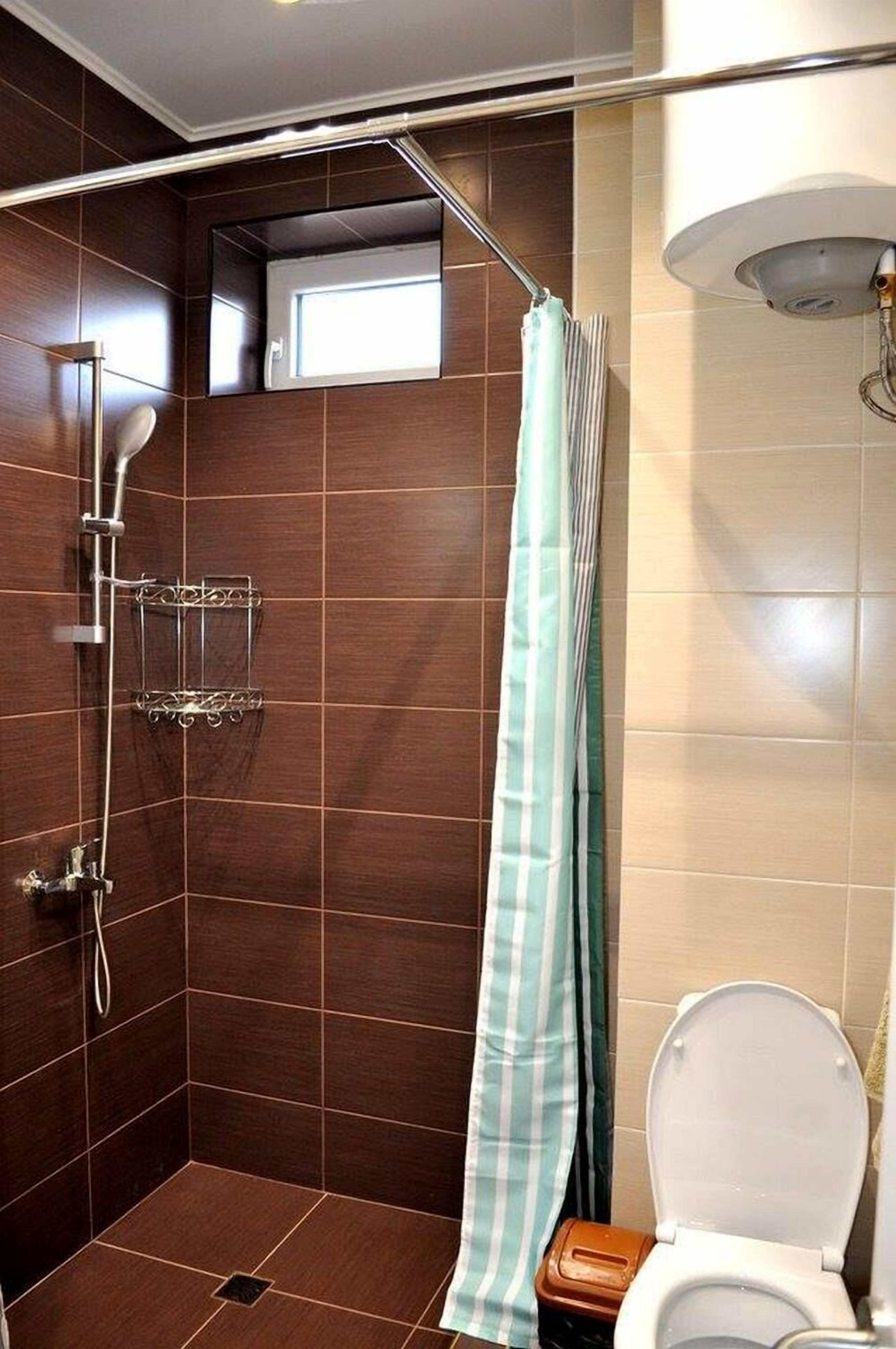 standard double or twin room | bathroom | shower, free toiletries, hair dryer, towels