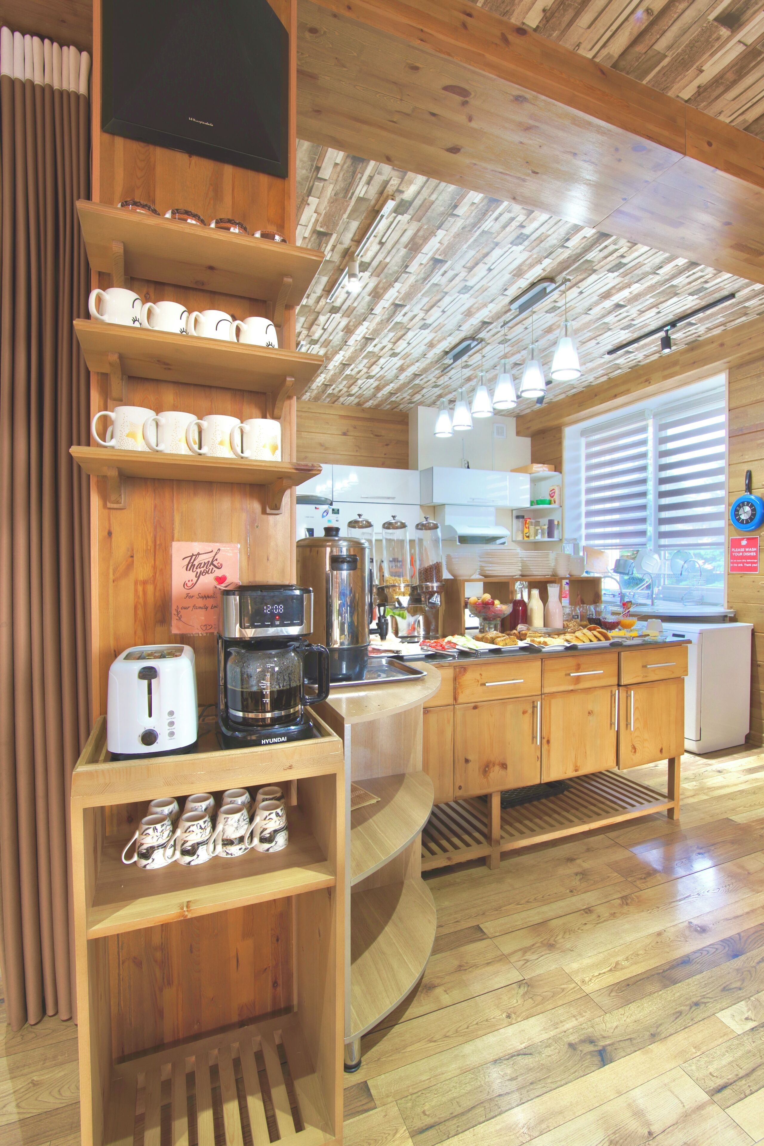 A kitchen with wooden cabinets, a coffee maker, and a toaster.