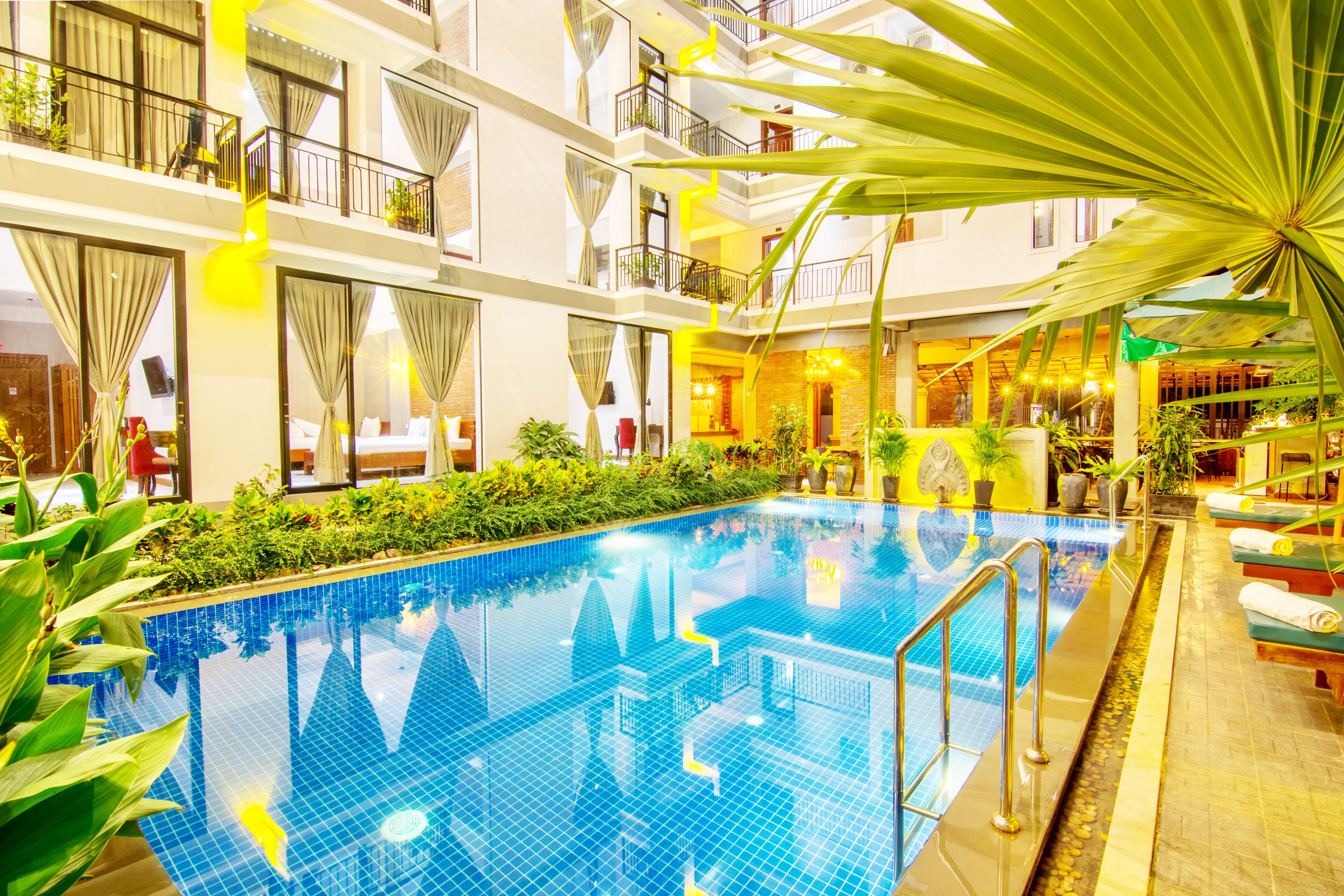 outdoor pool, open 9:00 am to 9:00 pm, pool umbrellas, pool loungers