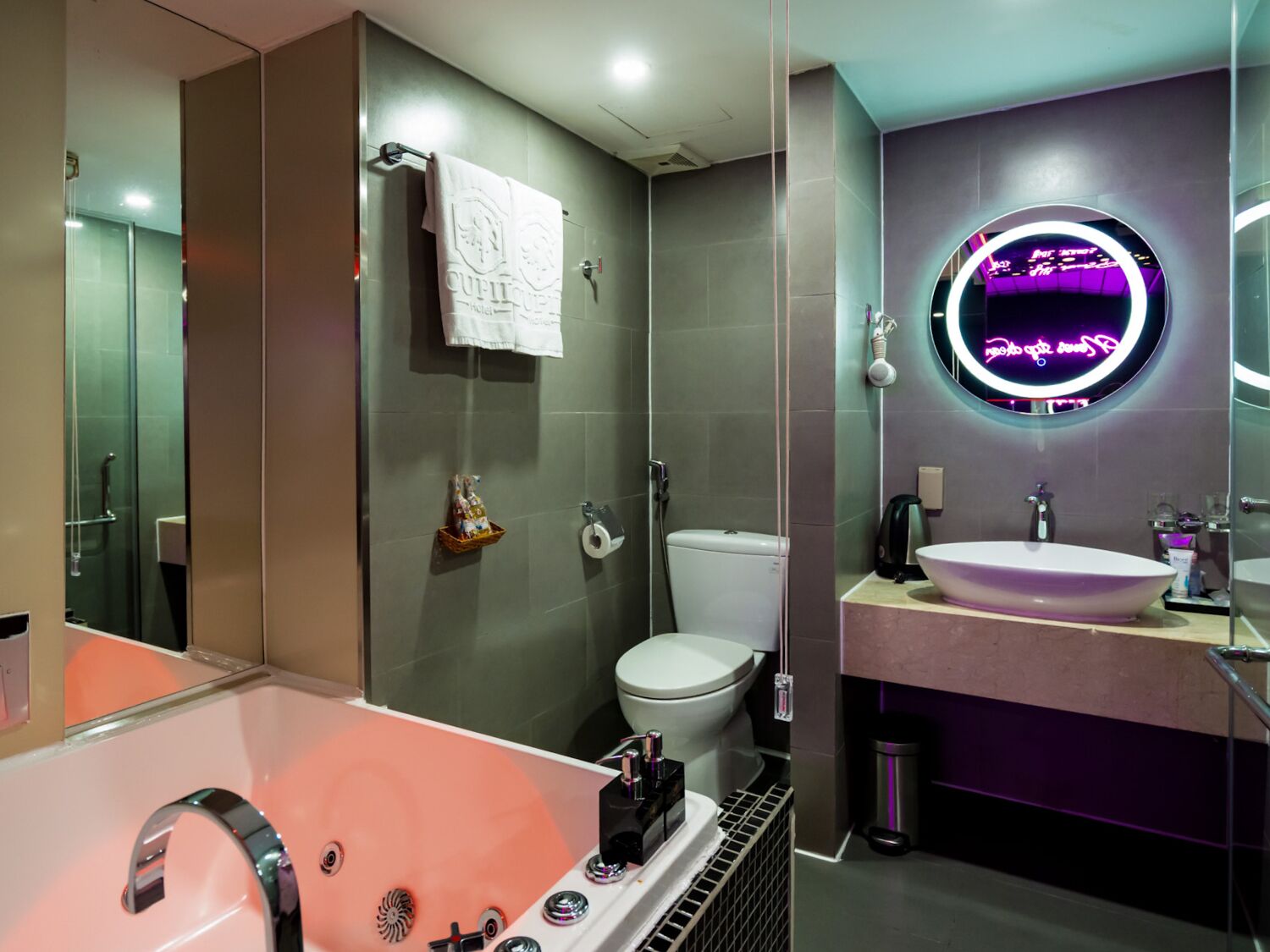 deluxe room, jetted tub | bathroom | free toiletries, hair dryer, slippers, bidet