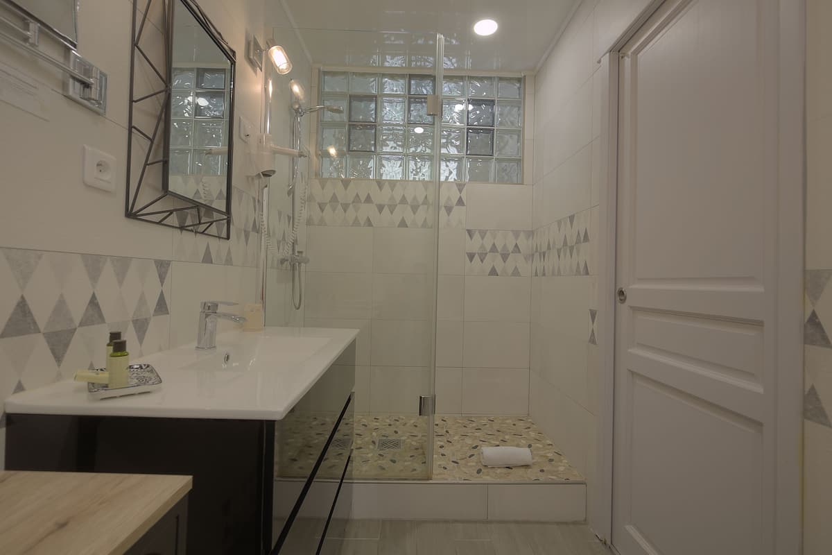 family room | bathroom | shower, free toiletries, hair dryer, towels