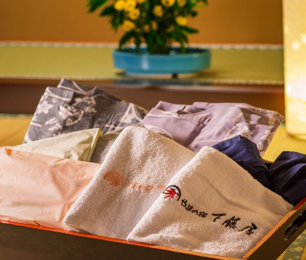 A box containing several towels with Japanese characters.