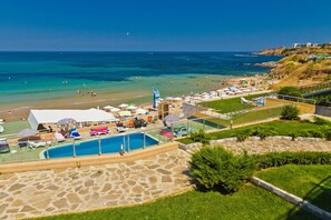 A resort with a swimming pool, beach, and ocean view. - Black Sea Paradise (Sozopol)