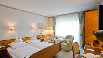 Hypo-allergenic bedding, down duvets, in-room safe