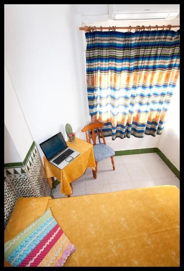 Desk, laptop workspace, blackout curtains, rollaway beds