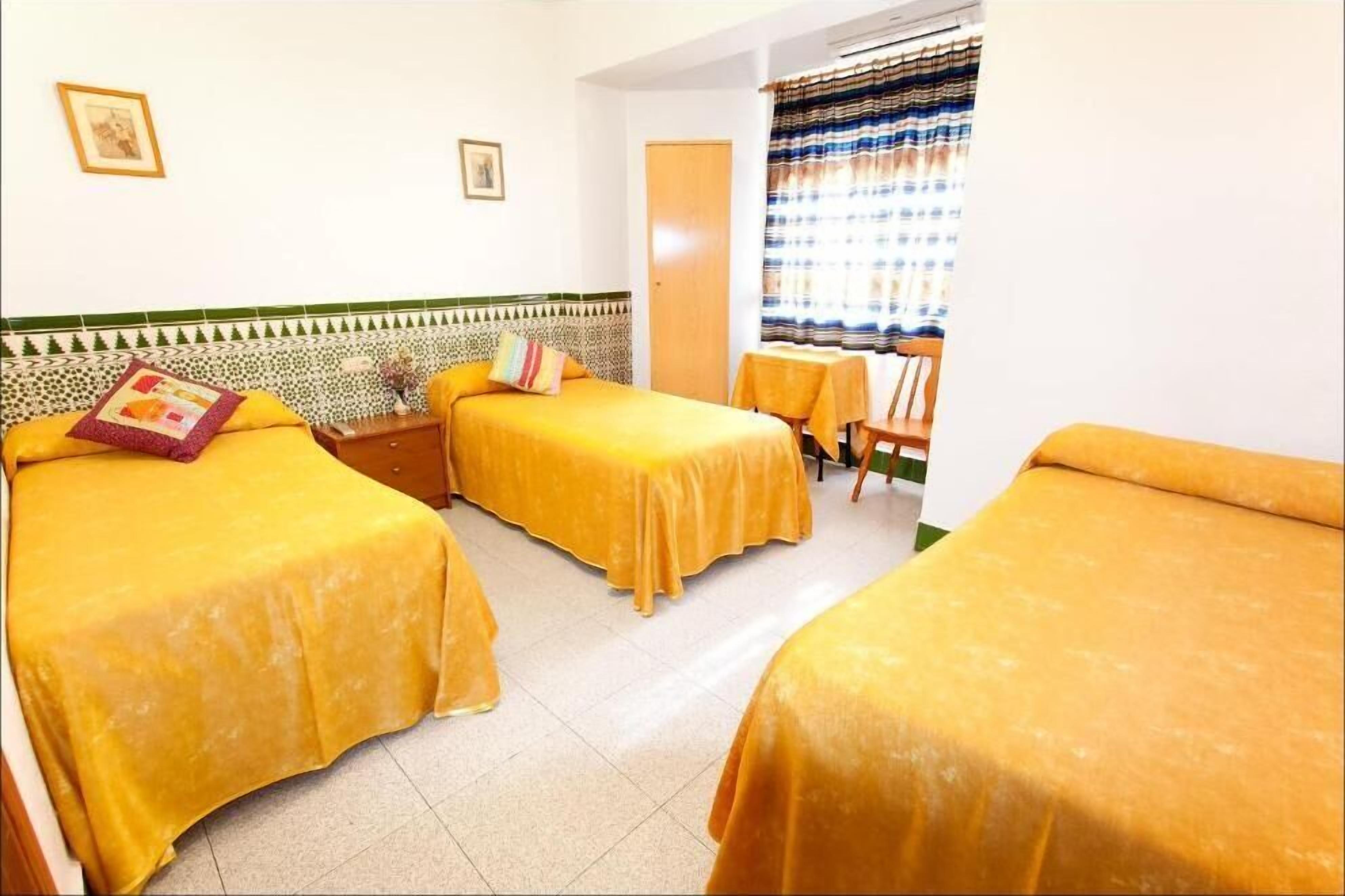 Desk, laptop workspace, blackout curtains, rollaway beds