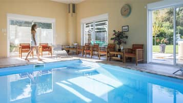 Indoor pool, open 9 AM to 9 PM, pool loungers