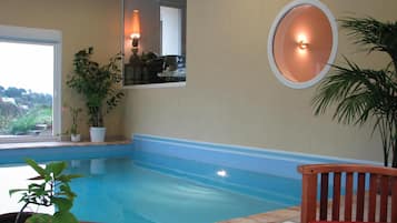 Indoor pool, open 9 AM to 9 PM, pool loungers